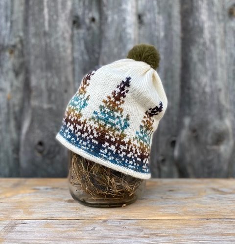 Knitted hat with spruces – sunset in the woods