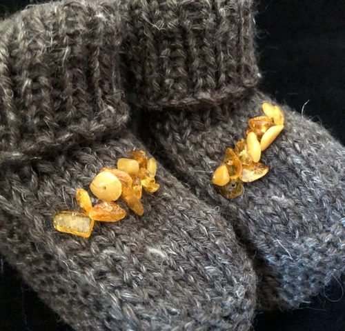 Baby booties with small amber