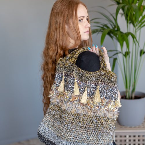 Handmade knitted bag with gold tassels