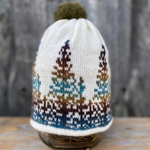Knitted hat with spruces – sunset in the woods