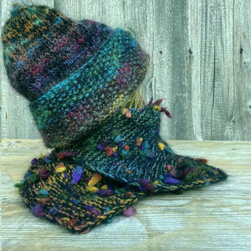 Hand knitted thick warm wool hat with a neck warmer from soft green shades yarn